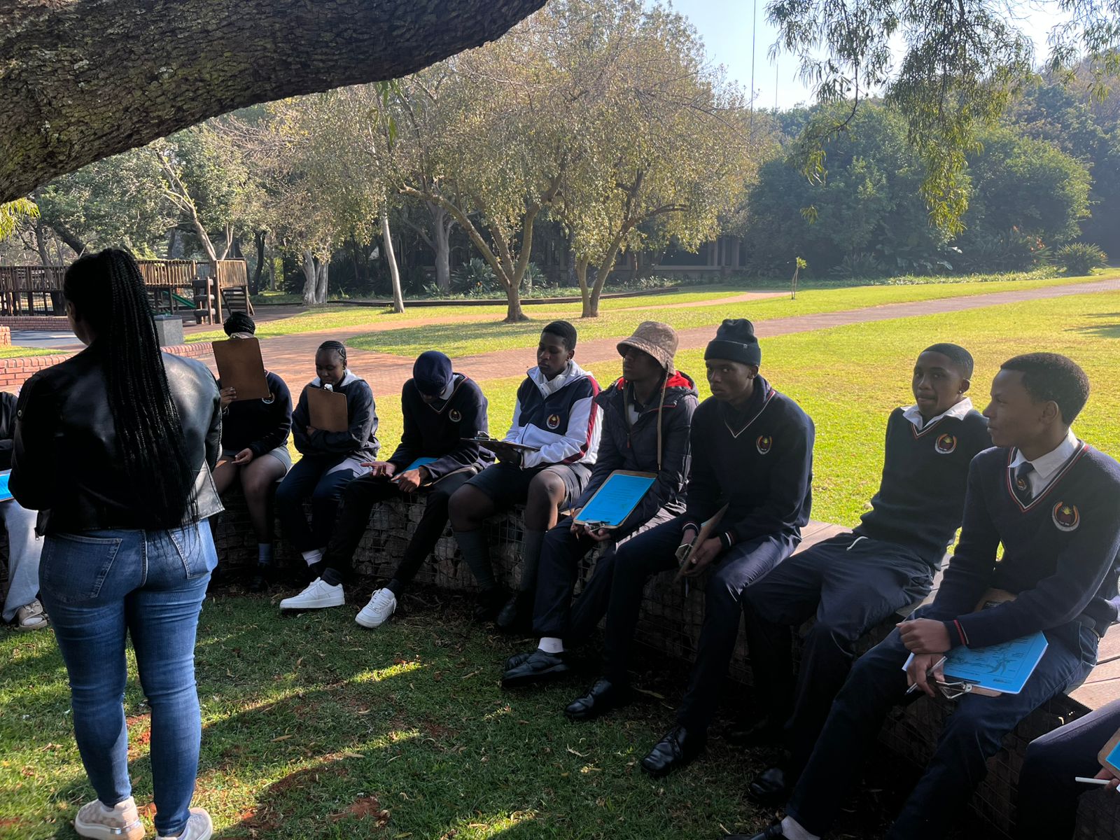 Princefield Trust learners seated during an outdoor lesson