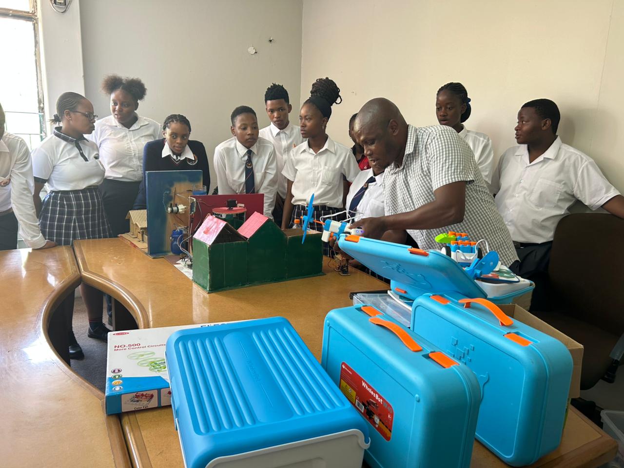 Princefield Trust pupils using a balance scale in a science lesson